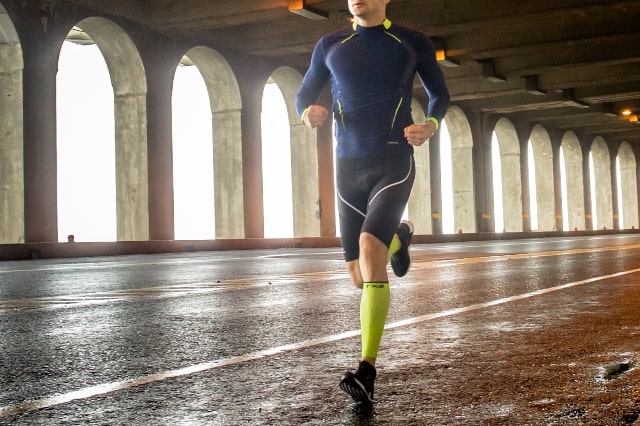 Runner wearing txg calf sleeves