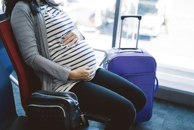 Pregant woman at an airport