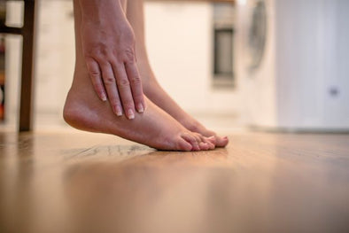 massaging painful foot