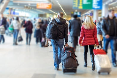 passengers walking through an airport